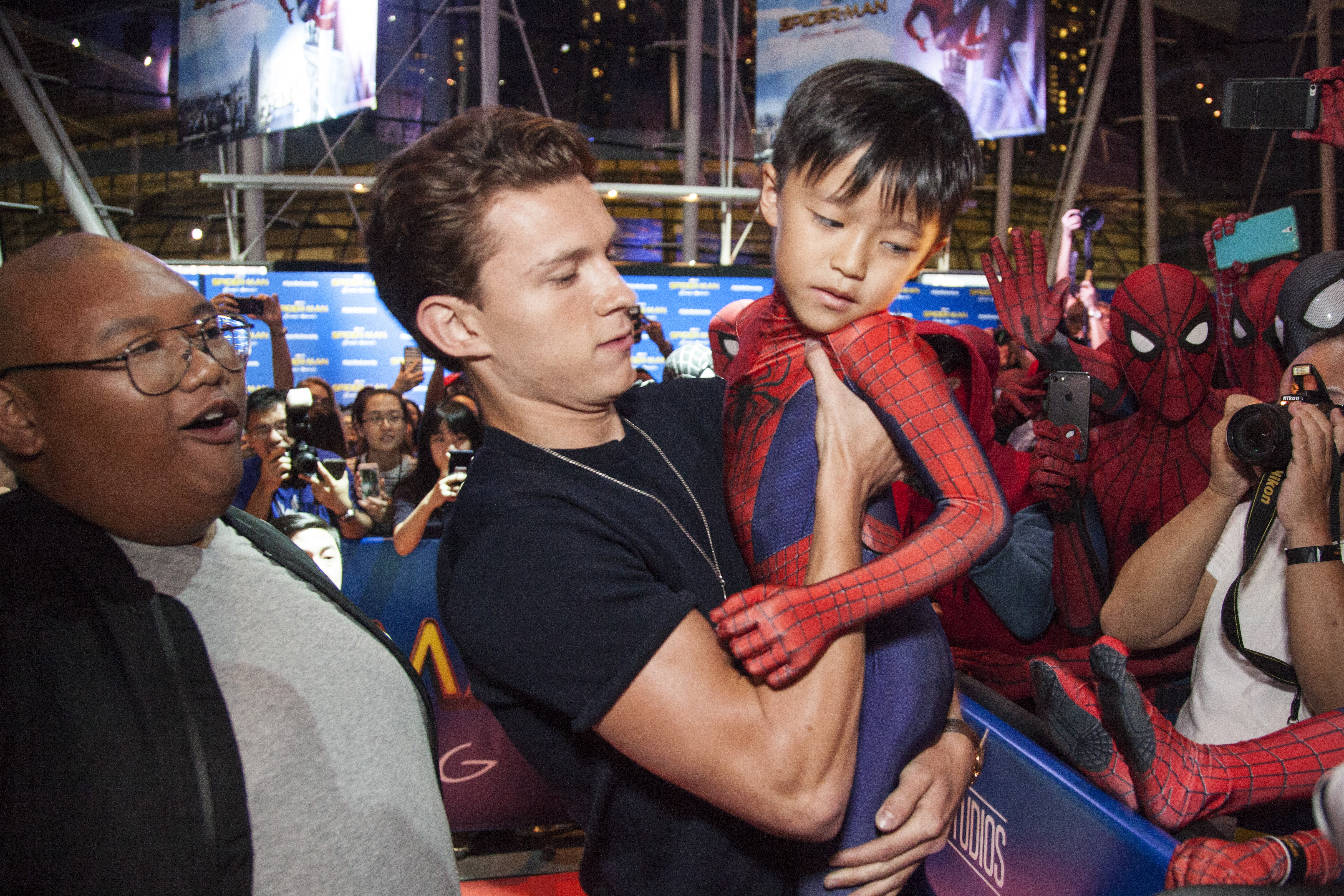 SINGAPORE - JUNE 07:  Spider-Man: Homecoming stars Tom Holland and Jacob Batalon pose with fans at Marina Bay Sands on June 7, 2017 in Singapore.  (Photo by Ore Huiying/Getty Images for Sony Pictures)